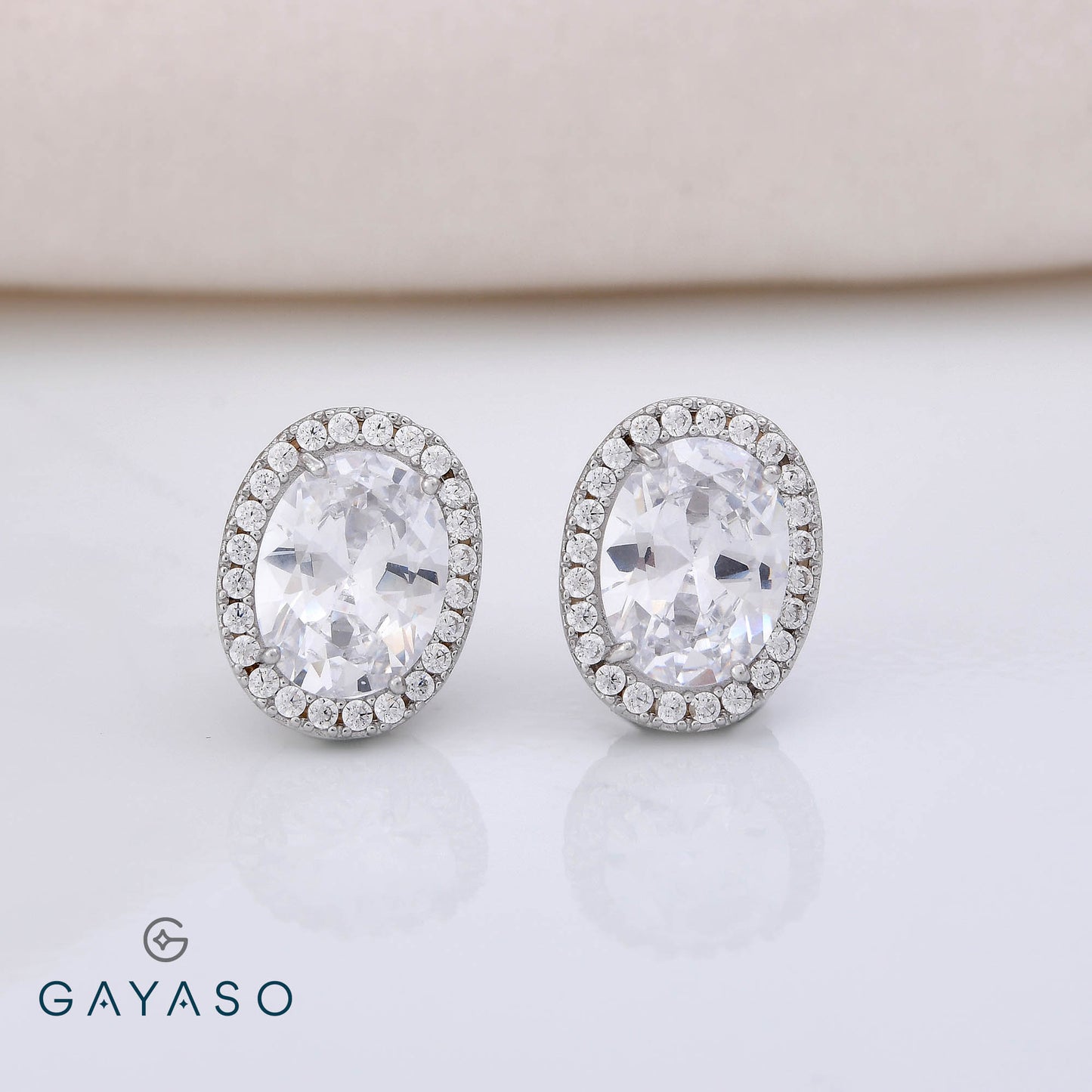 Oval Solitare Studs With Halo Setting Studs In Silver