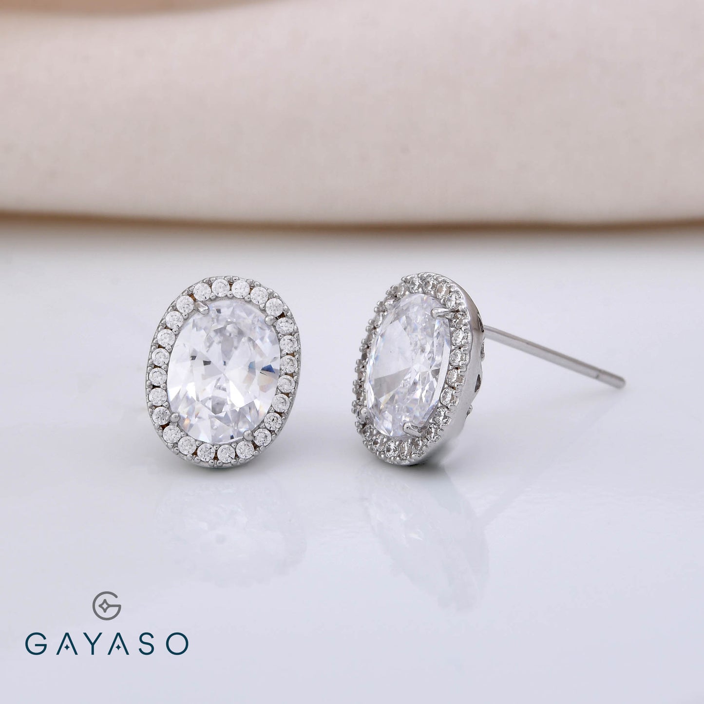 Oval Solitare Studs With Halo Setting Studs In Silver