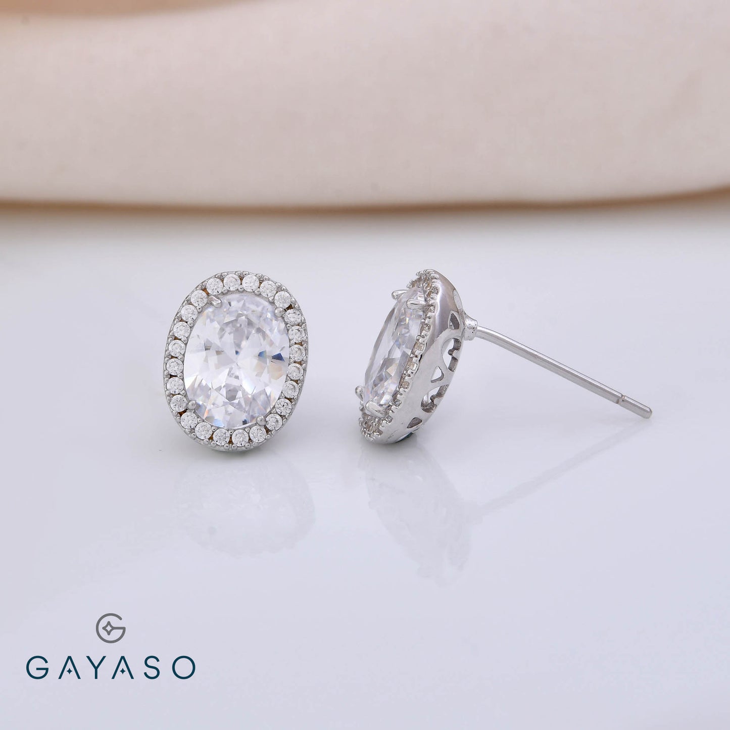 Oval Solitare Studs With Halo Setting Studs In Silver